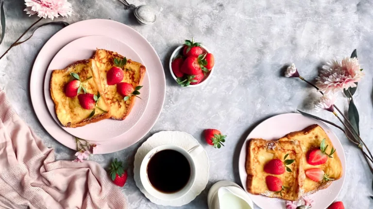 French toast with strawberries on pink plates with coffee – flat-lay café menu photography, Dubai