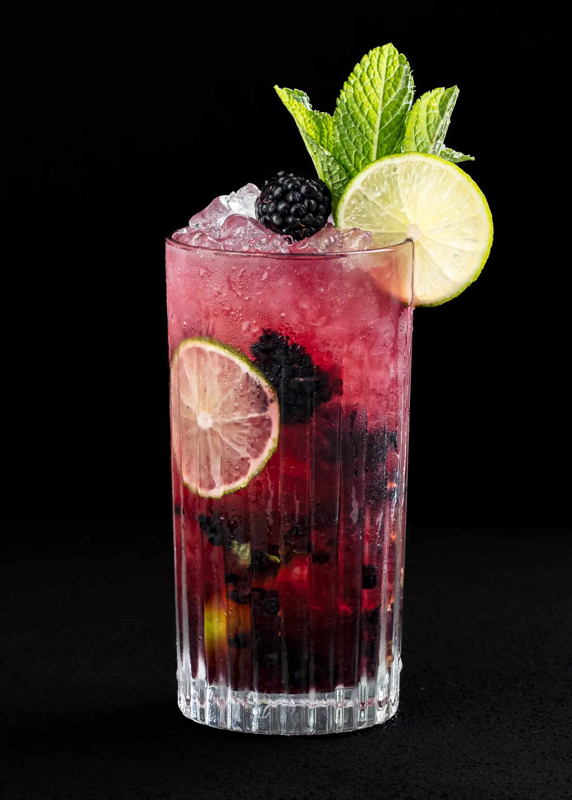 Blackberry and mint cocktail with lime on a black background – beverage photography by My Pinch of Wow, Dubai