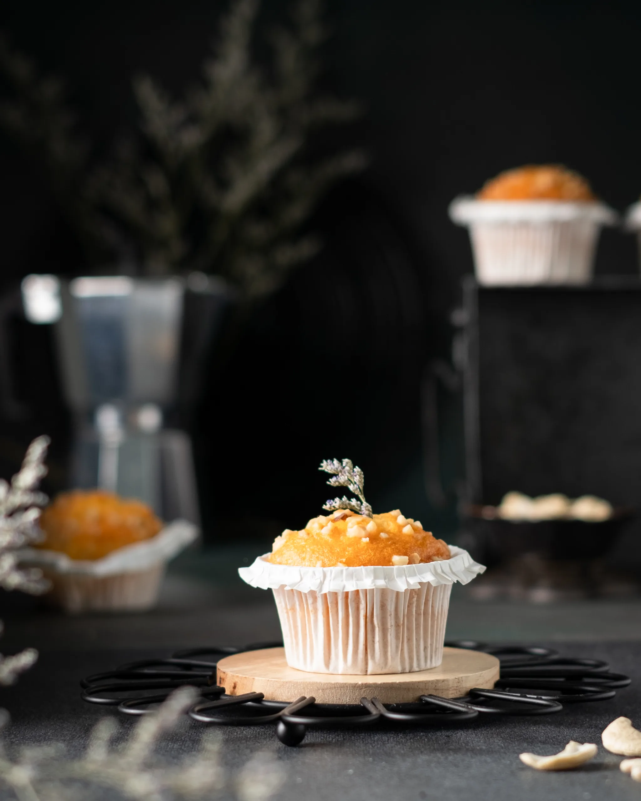 Muffin on a white plate with a moka pot in warm golden light – café bakery photography, Dubai