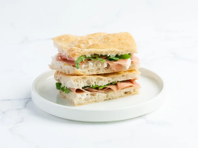 Chicken and salad sandwich on a white plate – café menu photography, Dubai