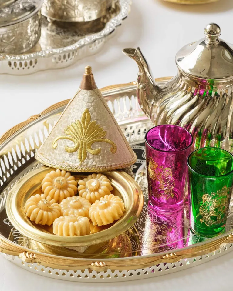 Arabic tea set with ma’amoul cookies, ornate teapot and coloured glasses – Middle Eastern food photography, Dubai